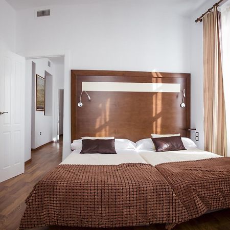 Apartamentos Casa De La Lonja Grenade Chambre photo